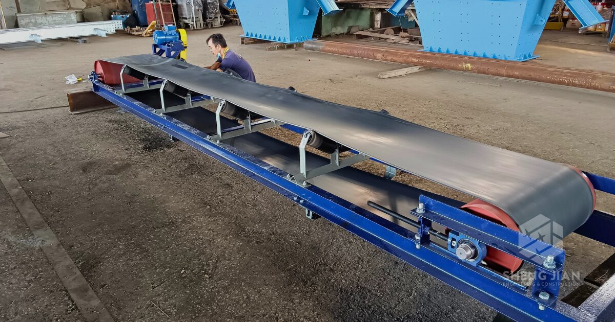 A belt conveyor transporting materials in an industrial setting