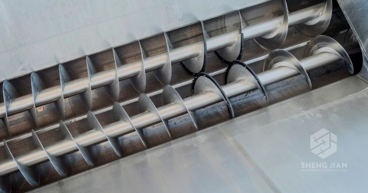 Stainless steel conveyors in a facility.