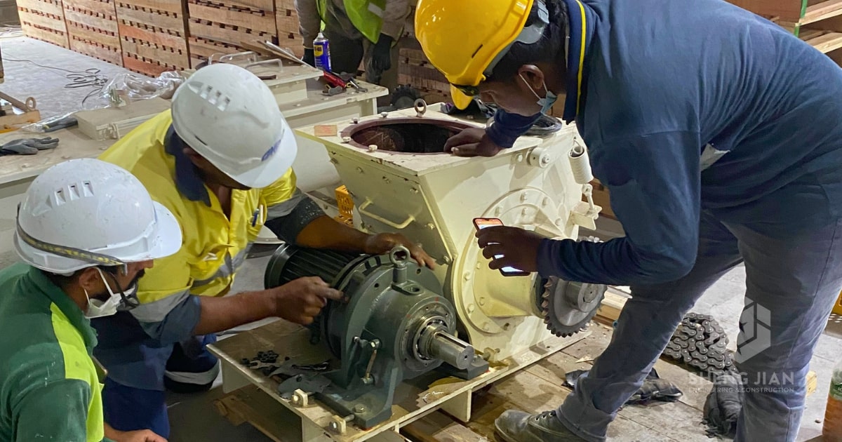 A team installing industrial equipment on-site.